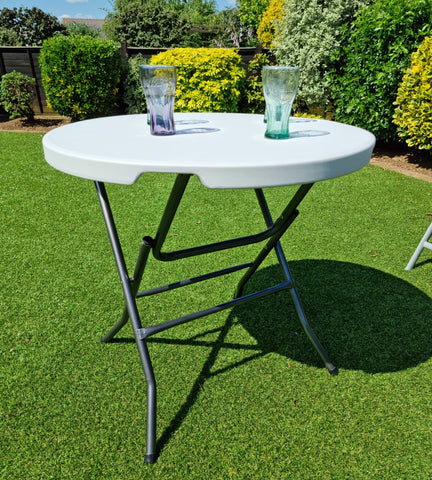 Blow moulded white 6ft folding table with folding legs, carry handle and lock, easy to store